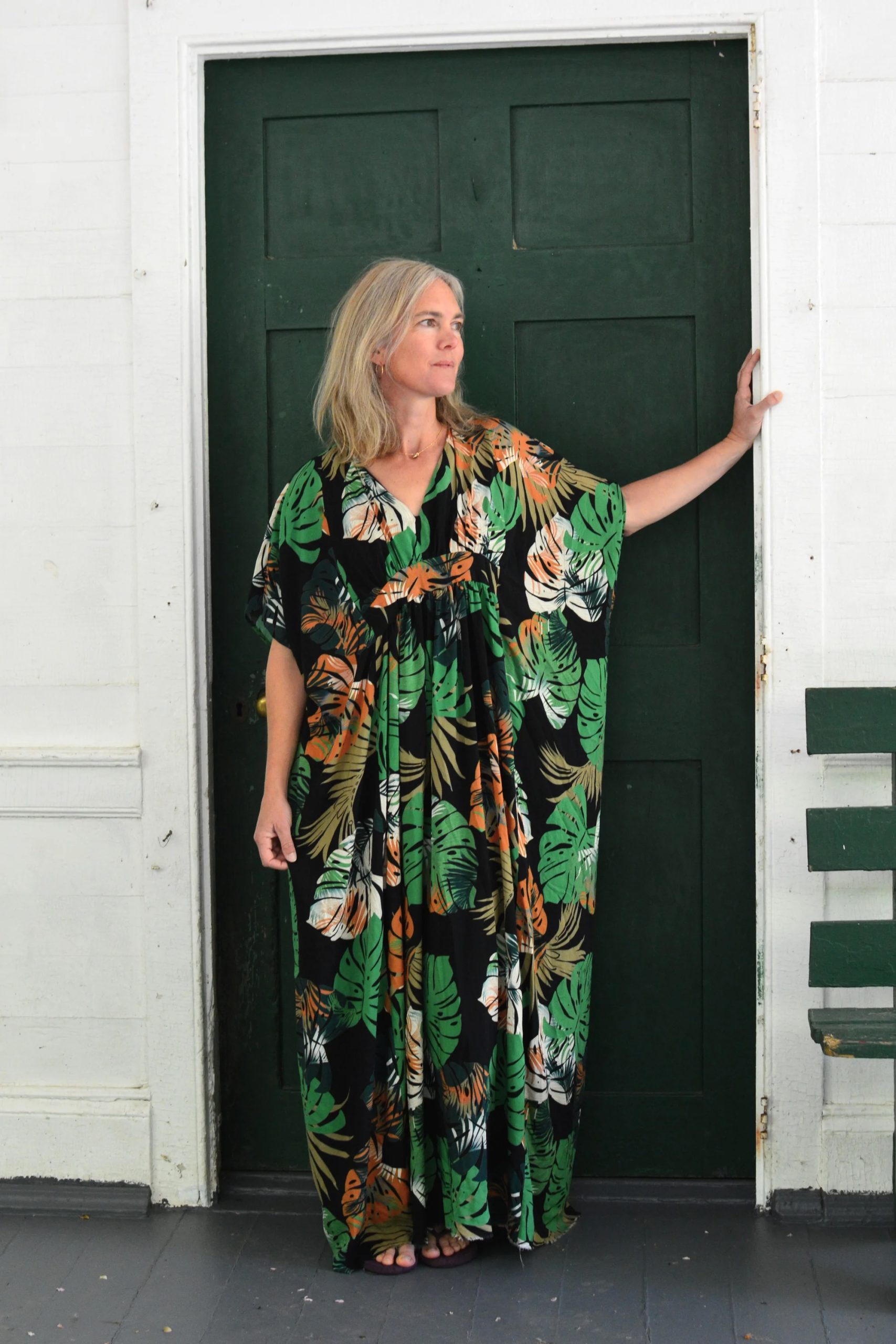 Woman wearing the 280 Resort Kaftan sewing pattern from Folkwear on The Fold Line. A pullover dress pattern made in silk, cotton gauze, voile, lawn, silk/cotton blends, handkerchief linen, rayon challis, or Tencel fabric, featuring 1970s styling with a V-