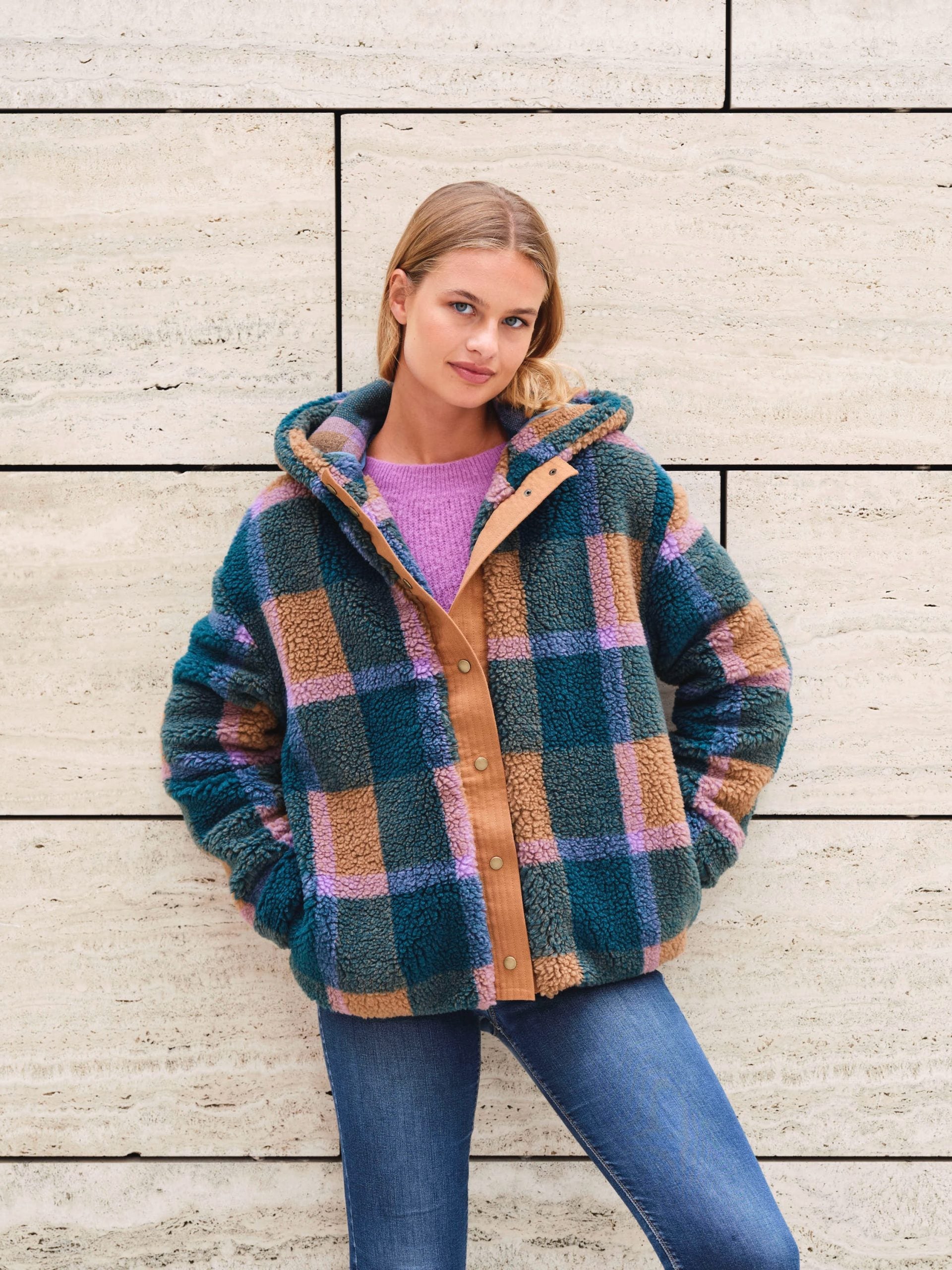 Women wearing the Dani Jacket sewing pattern from Atelier Jupe on The Fold Line. A jacket pattern made in teddy, quilted or wool blend fabrics, featuring a snap button placket, hood, slightly oversized, dropped shoulders, pockets, and fully lined.