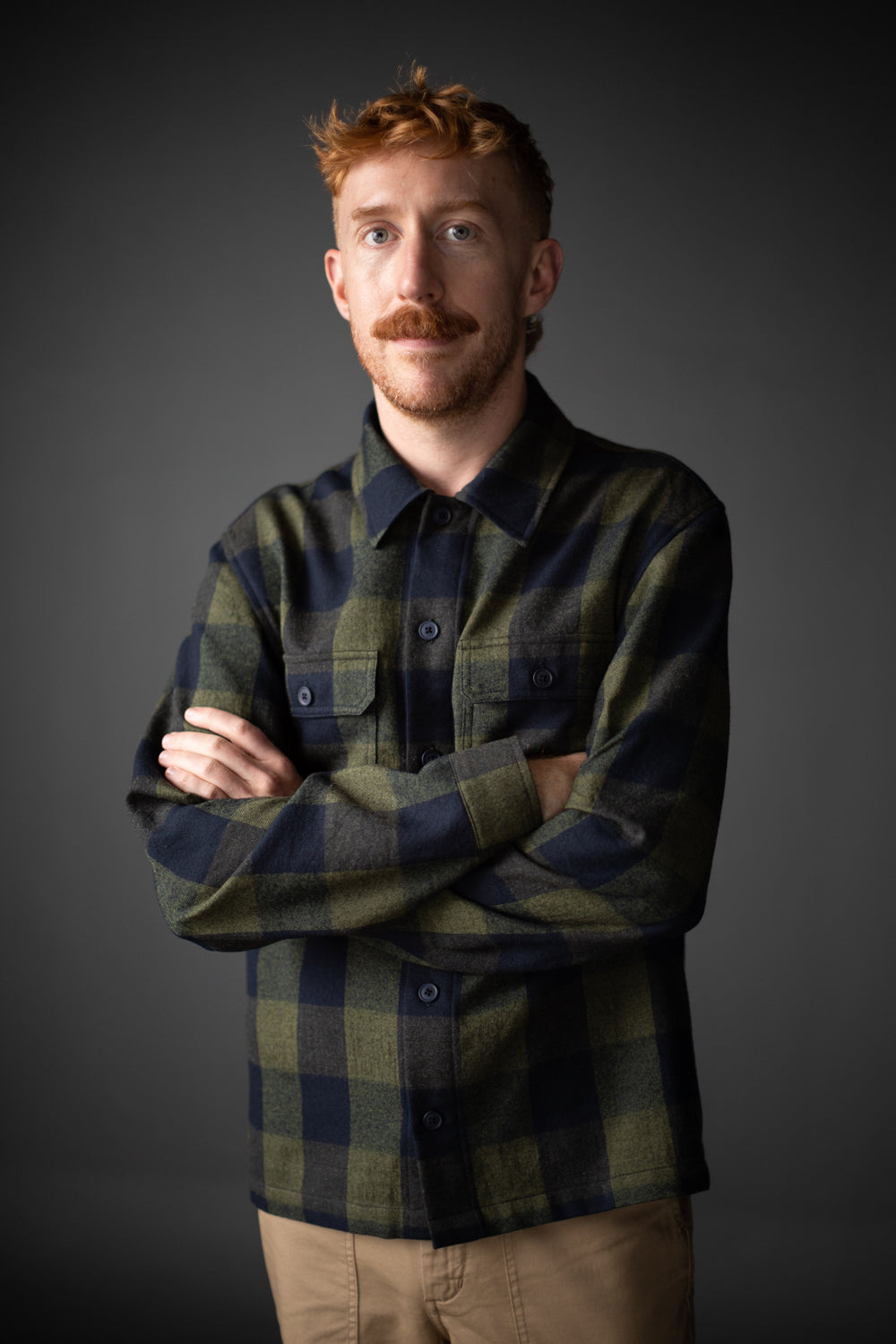Man wearing The Men's Arbor Jacket or Shirt sewing pattern from Merchant & Mills on The Fold Line. A Gilet pattern made in denim, light-medium weight corduroy, wool, wool blends, cotton canvas or twill fabrics, featuring a stand collar, front patch pocket