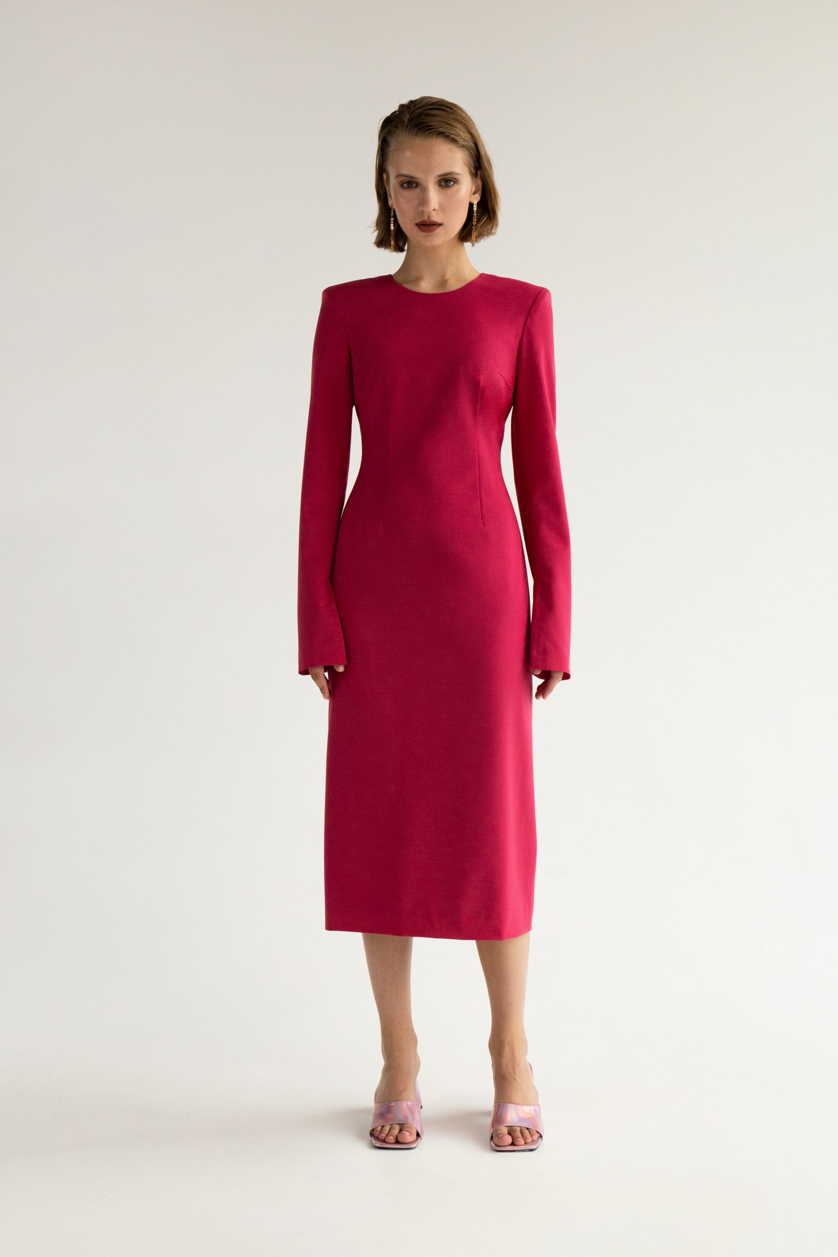 Woman wearing the Asel Dress sewing pattern from Vikisews on The Fold Line. A dress pattern made in wool, viscose, gabardine, dress-weight denim, micro corduroy, modal or faux leather fabrics, featuring a semi-fit, accentuated waist, bust darts, front and