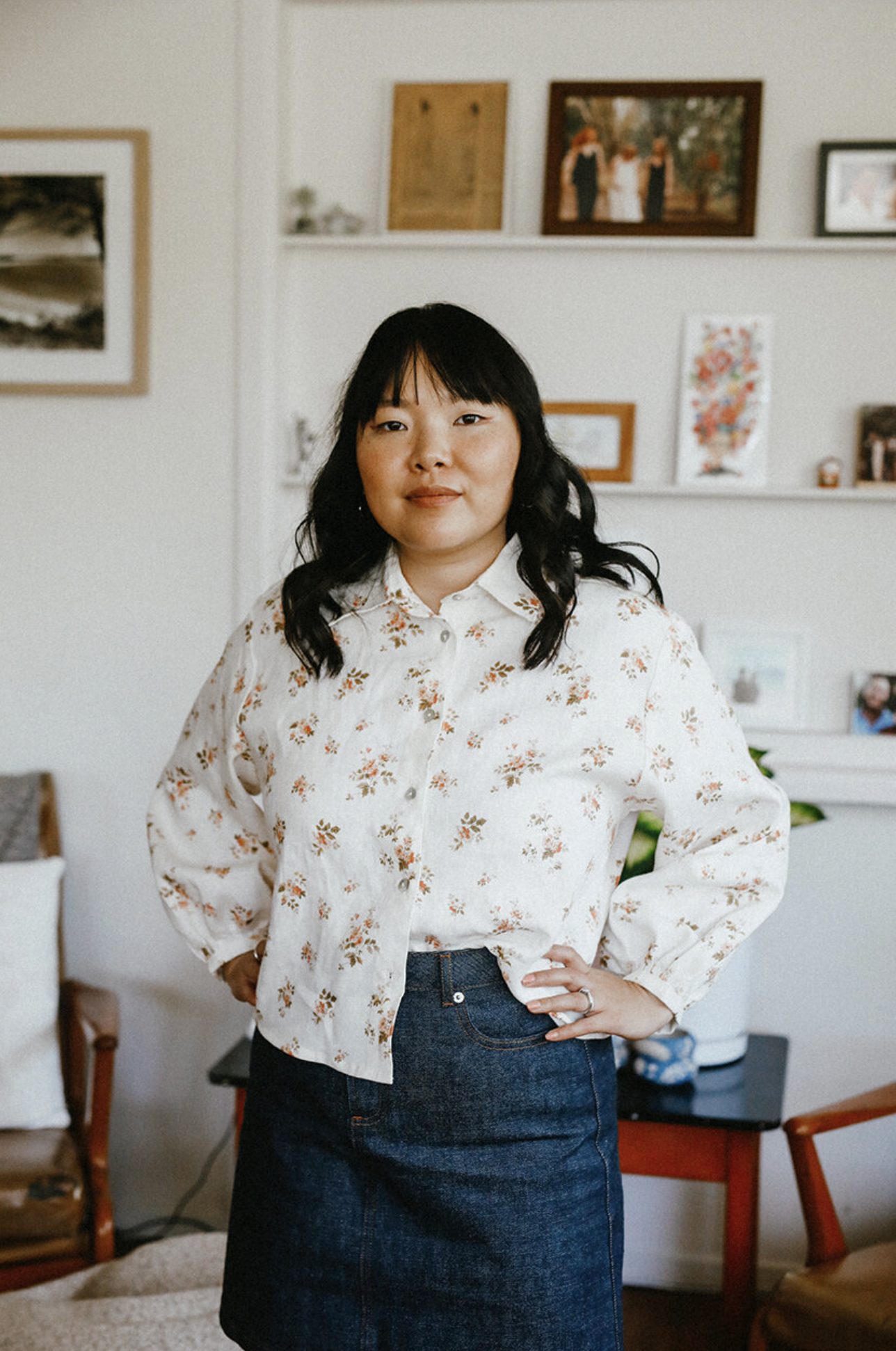Woman wearing the Bellbird Button Up Shirt sewing pattern from Common Stitch on The Fold Line. A shirt pattern made in linen fabrics, featuring long bishop sleeves, front button closure, collar, and boxy cropped silhouette.