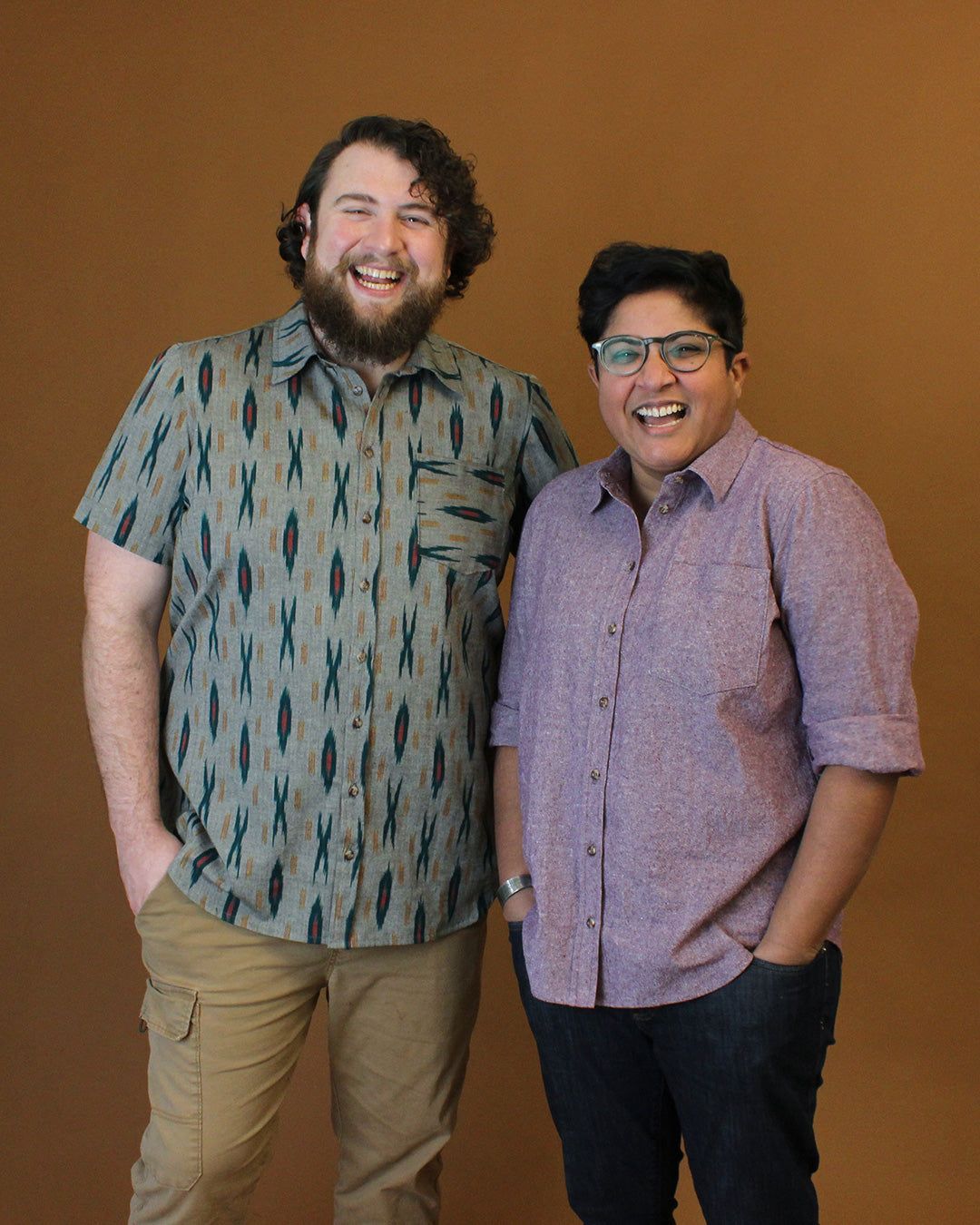 Models wearing the Cameron Button Up Shirt sewing pattern from Helen's Closet on The Fold Line. A shirt pattern made in linen, cotton, wool, hemp, rayon/viscose challis, poplin, or tencel fabric, featuring a boxy fit, collar and collar stand, front button placket, long or short sleeves, and a chest pocket.