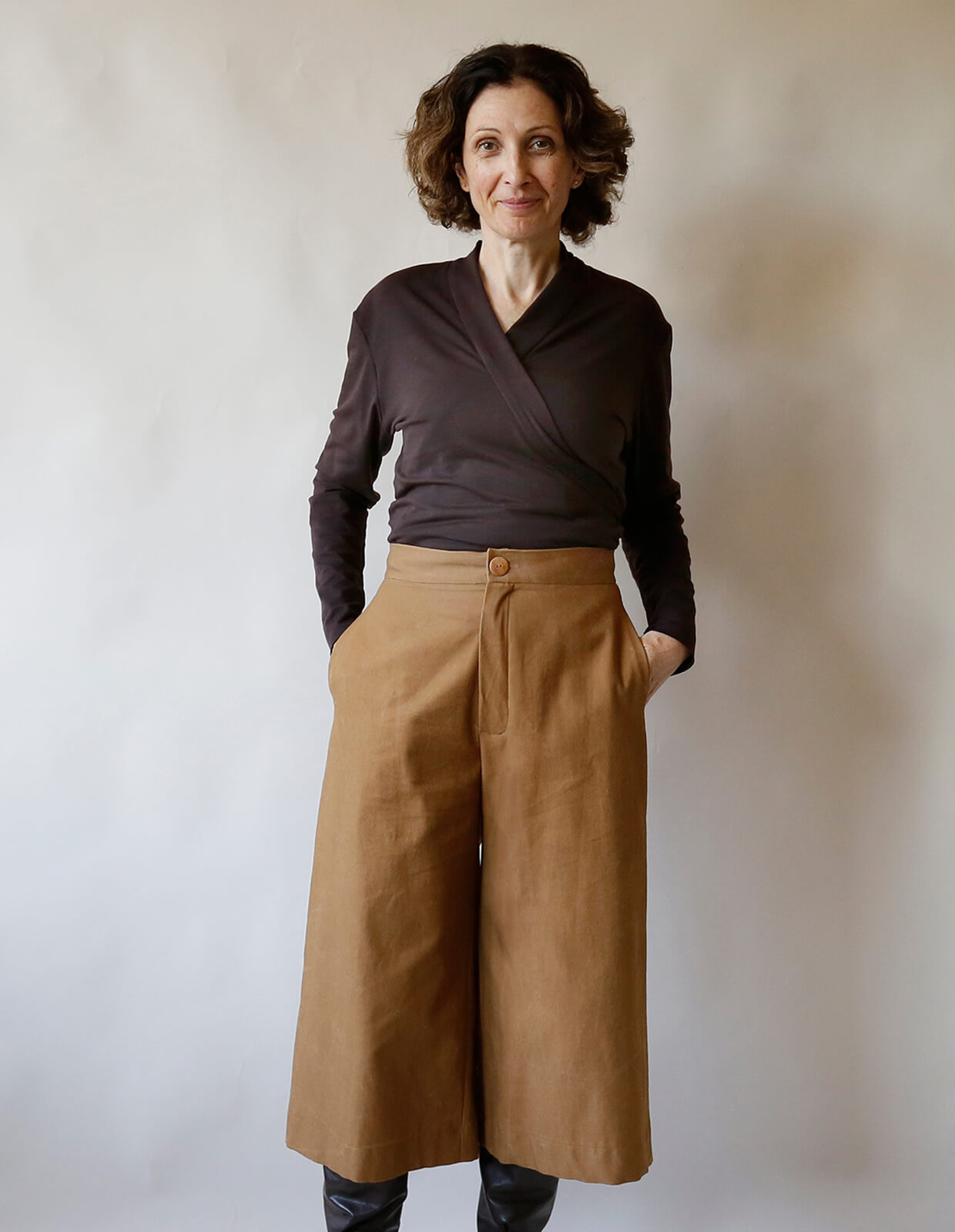 Woman wearing the Culottes sewing pattern from The Maker's Atelier on The Fold Line. A culottes pattern made in cotton drill, canvas, denim, or wool suiting fabric, featuring a flat front, zip fly, side pockets, wide leg, and cropped length.