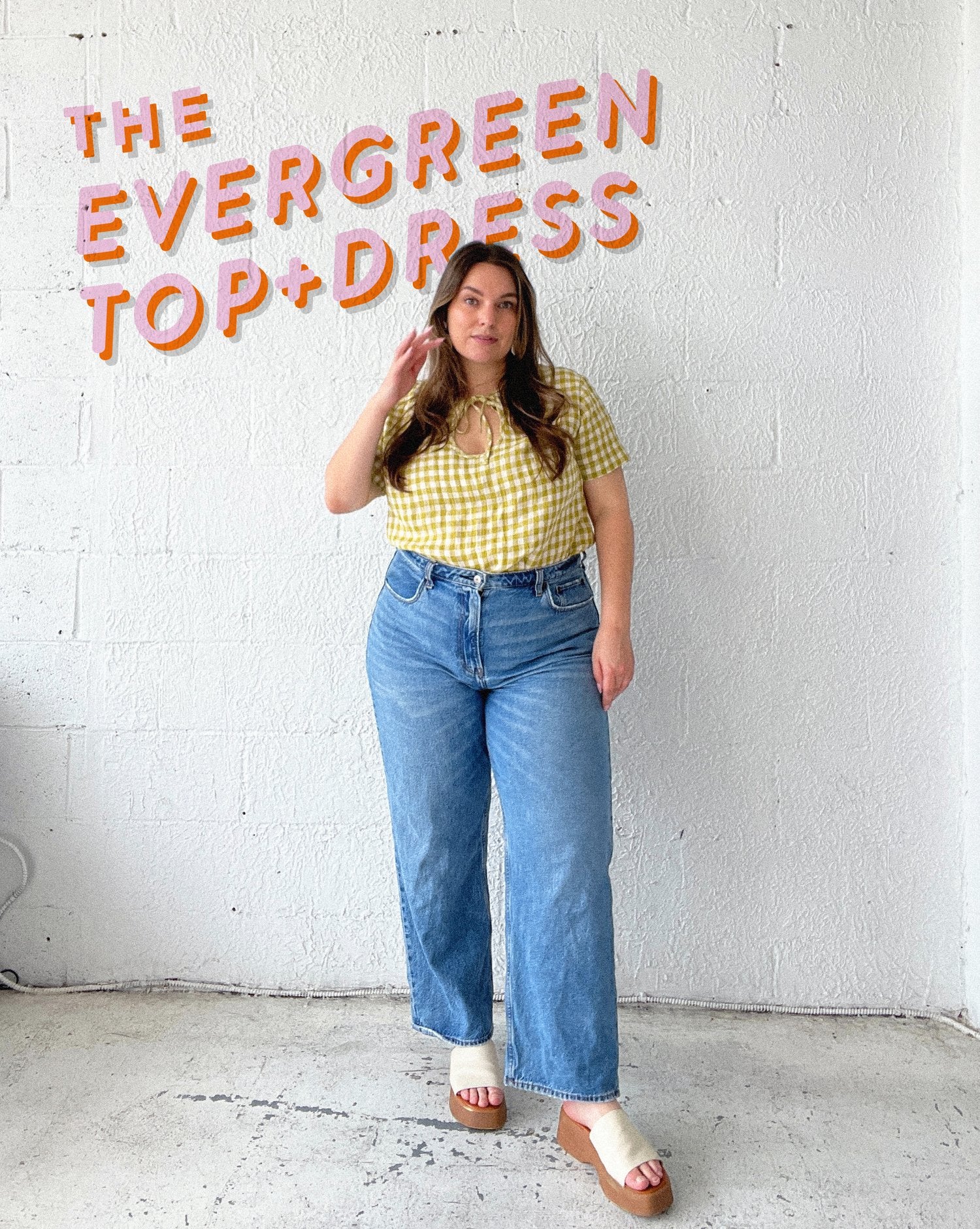 Woman wearing the Evergreen Top sewing pattern from Les Perlines on The Fold Line. A top pattern made in rayon, viscose, cotton, linen, or tencel twill fabric, featuring a boxy fit, keyhole detail at the front, and short sleeves.