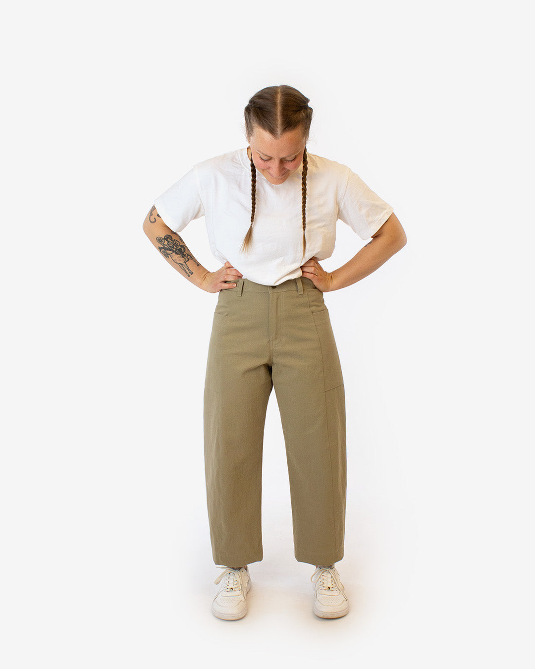 Woman wearing the Falconer Pants sewing pattern from Helen's Closet on The Fold Line. A trousers pattern made in denim, cotton twill, canvas, or corduroy fabric, featuring a curved waistband, zipper fly, side panels with set-in pockets, barrel leg, and ankle length.