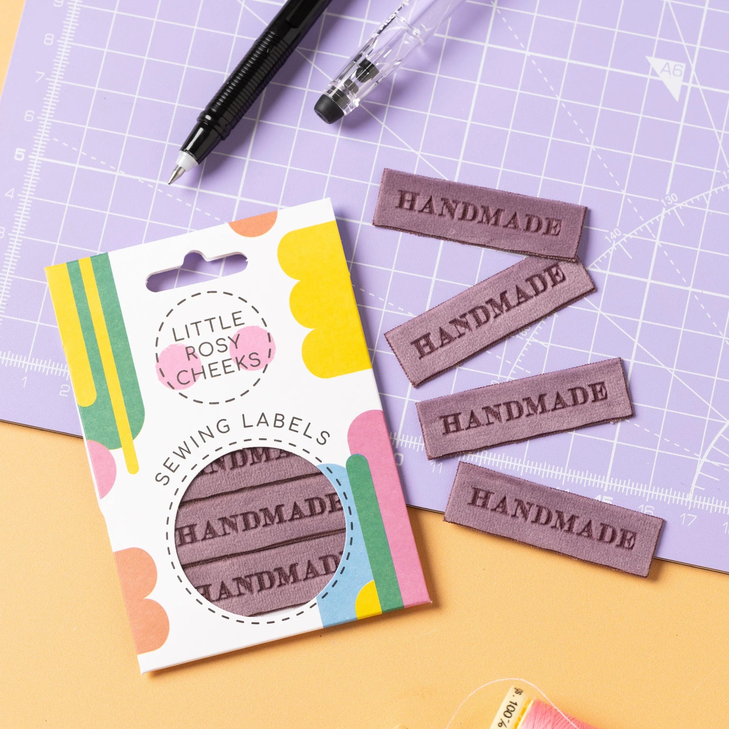 The ‘Handmade Velvet' woven labels from Little Rosy Cheeks on The Fold Line. The pack includes 4 labels featuring laser engraved text on a lilac velvet background, ready to be sewn into your handmade clothes.