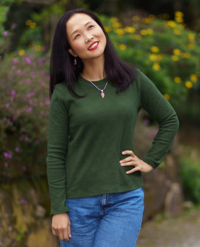 Woman wearing the Kashi Tee sewing pattern from Itch to Stitch on The Fold Line. A T-shirt pattern made in jersey, viscose or rayon French terry, interlock, or sweater knit fabric, featuring a round neckline and long sleeves.
