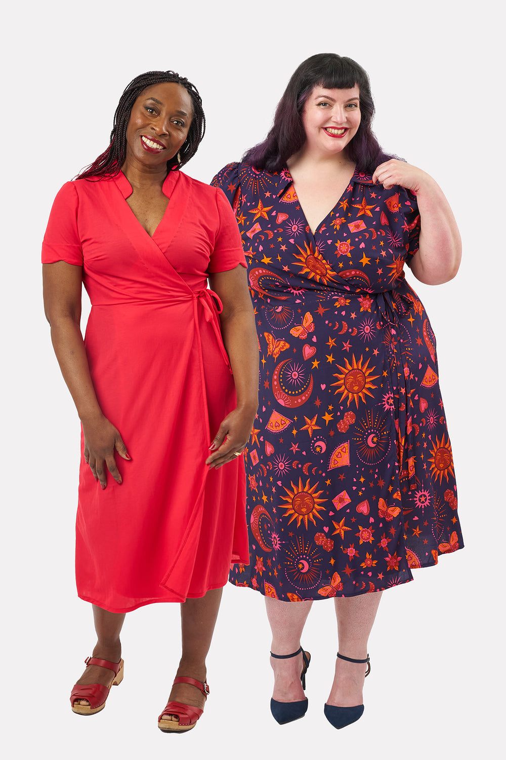 Women wearing the Lori Dress sewing pattern from Sew Over It on The Fold Line. A wrap dress pattern made in viscose, crepe, lightweight linen, or cotton fabric, featuring a pointed flat or mandarin-style collar, V-neck, bust darts, waist darts, short sleeves, waist ties, and midi length.