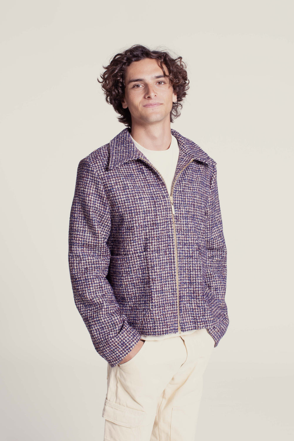 Man wearing the Men's Bear Jacket sewing pattern from Wardrobe by Me on The Fold Line. A workwear-inspired jacket pattern made in denim, corduroy, wool or canvas fabric, featuring a relaxed fit, front zipper closure, shirt-style collar, shoulder yoke, two large patch pockets, and full lining.