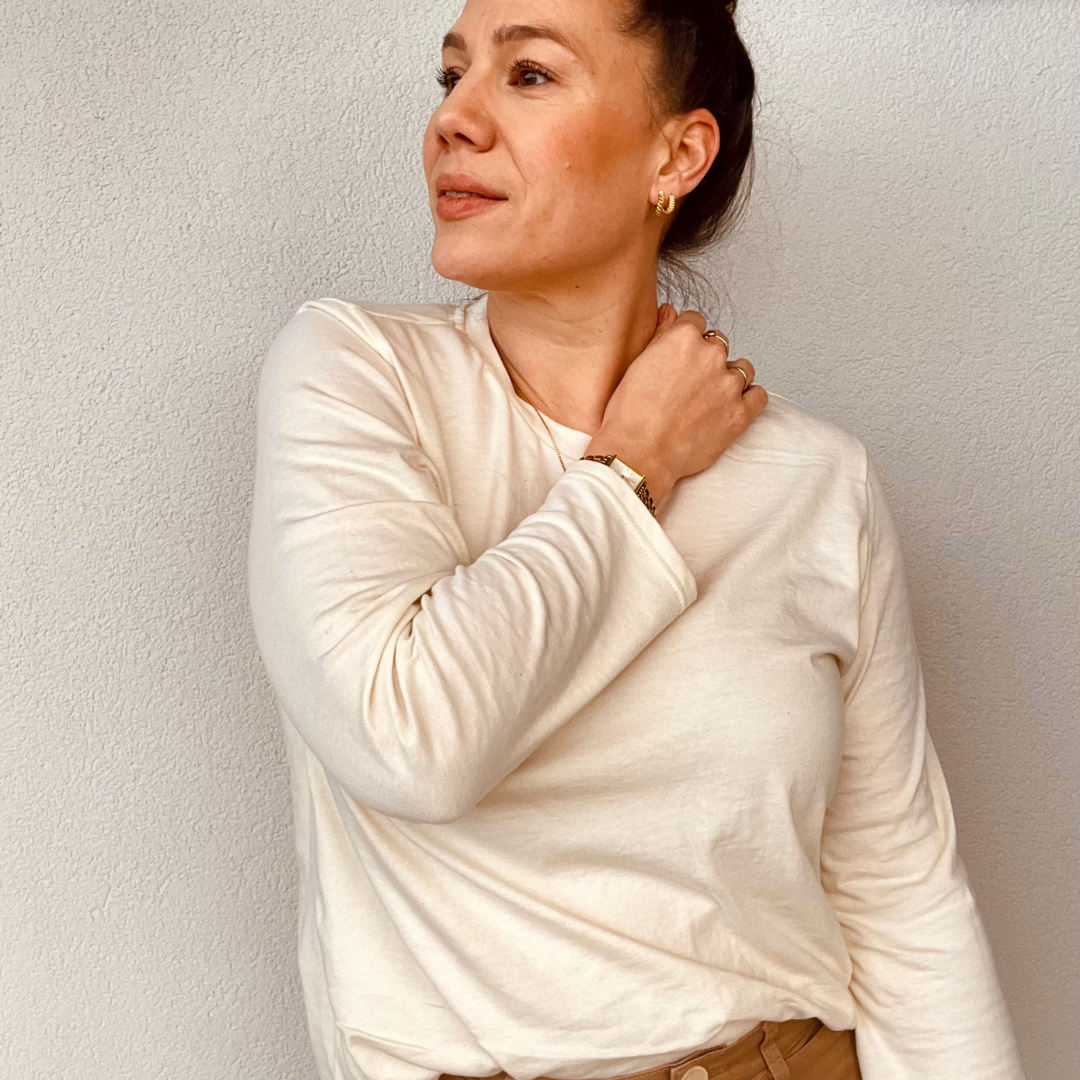 Woman wearing the Nora Tee Sleeve Extension sewing pattern from Sew.lala Patterns on The Fold Line. A T-shirt pattern made in cotton jersey, viscose jersey, ponte knit, or lightweight linen knit fabric, featuring a relaxed fit, round neck, and long sleeves.