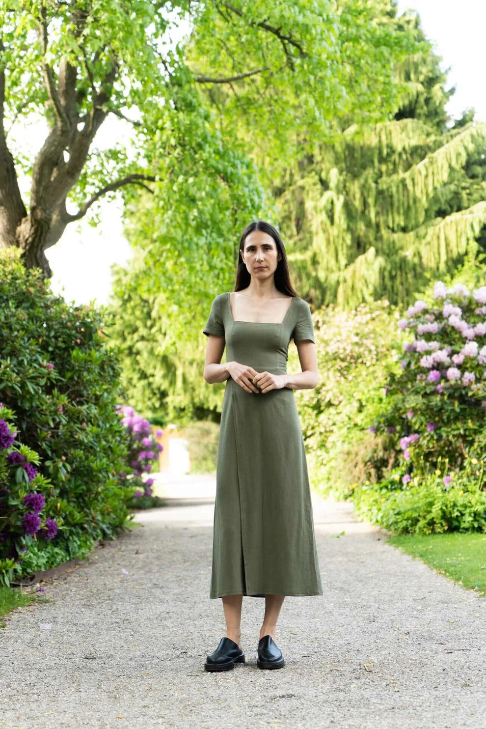 Woman wearing the Palma Dress & Tee Sleeve sewing pattern bundle from Puff and Pencil on The Fold Line. A dress and sleeve pattern bundle made in crepe, linen, poplin, woven viscose, taslan, cotton satin, or seersucker fabric, featuring a square neckline, princess seams, short sleeves, and midi length.