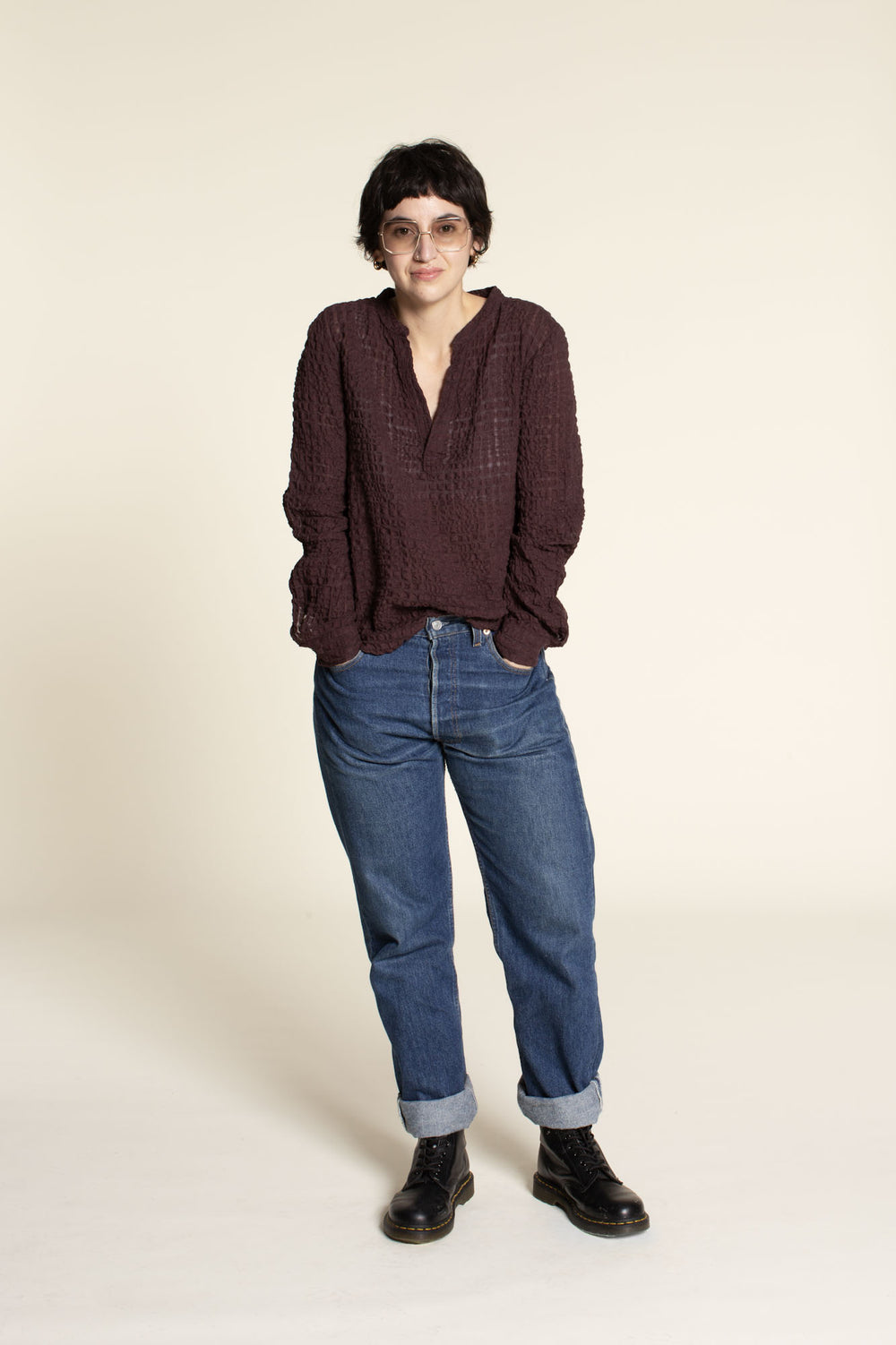 Woman wearing the Perfect Tunic sewing pattern from Wardrobe by Me on The Fold Line. A top pattern made in cotton, viscose, silk, linen, polyester, or jersey fabric, featuring a band collar, half placket, long sleeves, and relaxed fit.