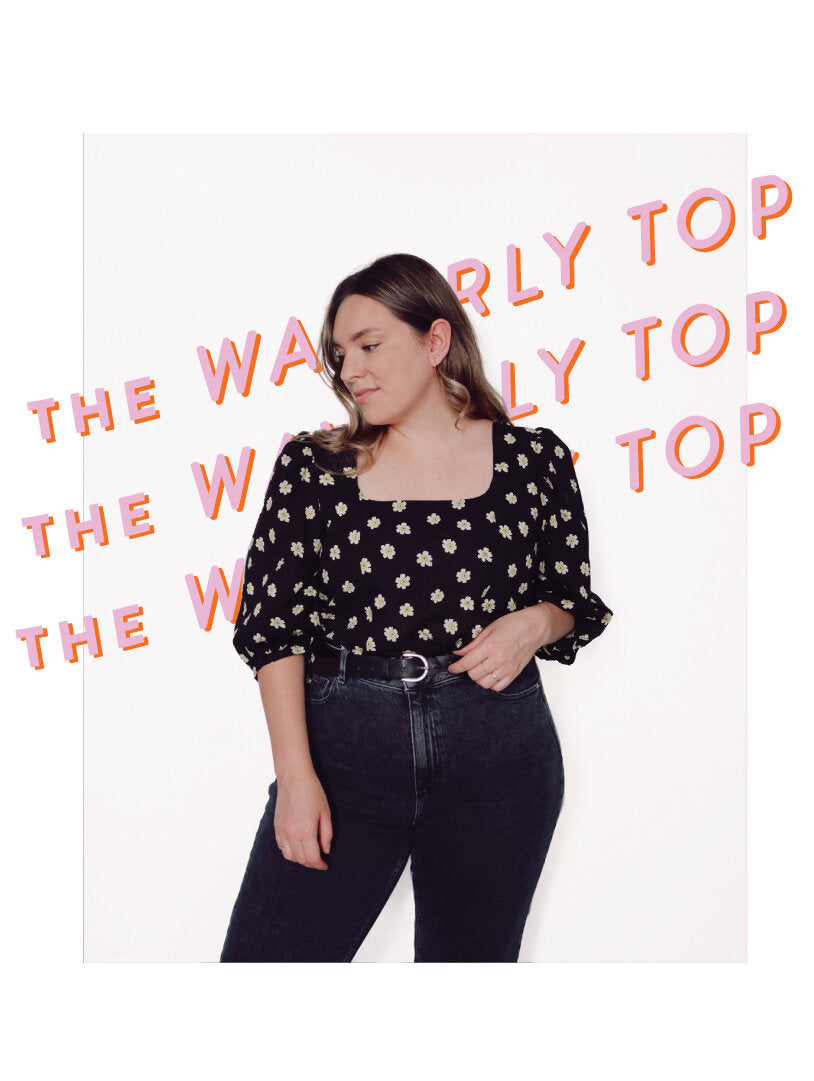 Woman wearing the Waverly Top sewing pattern from Les Perlines on The Fold Line. A blouse pattern made in rayon, viscose, cotton, or linen fabric, featuring a square neckline, princess seams, and mid-length puffy sleeves.