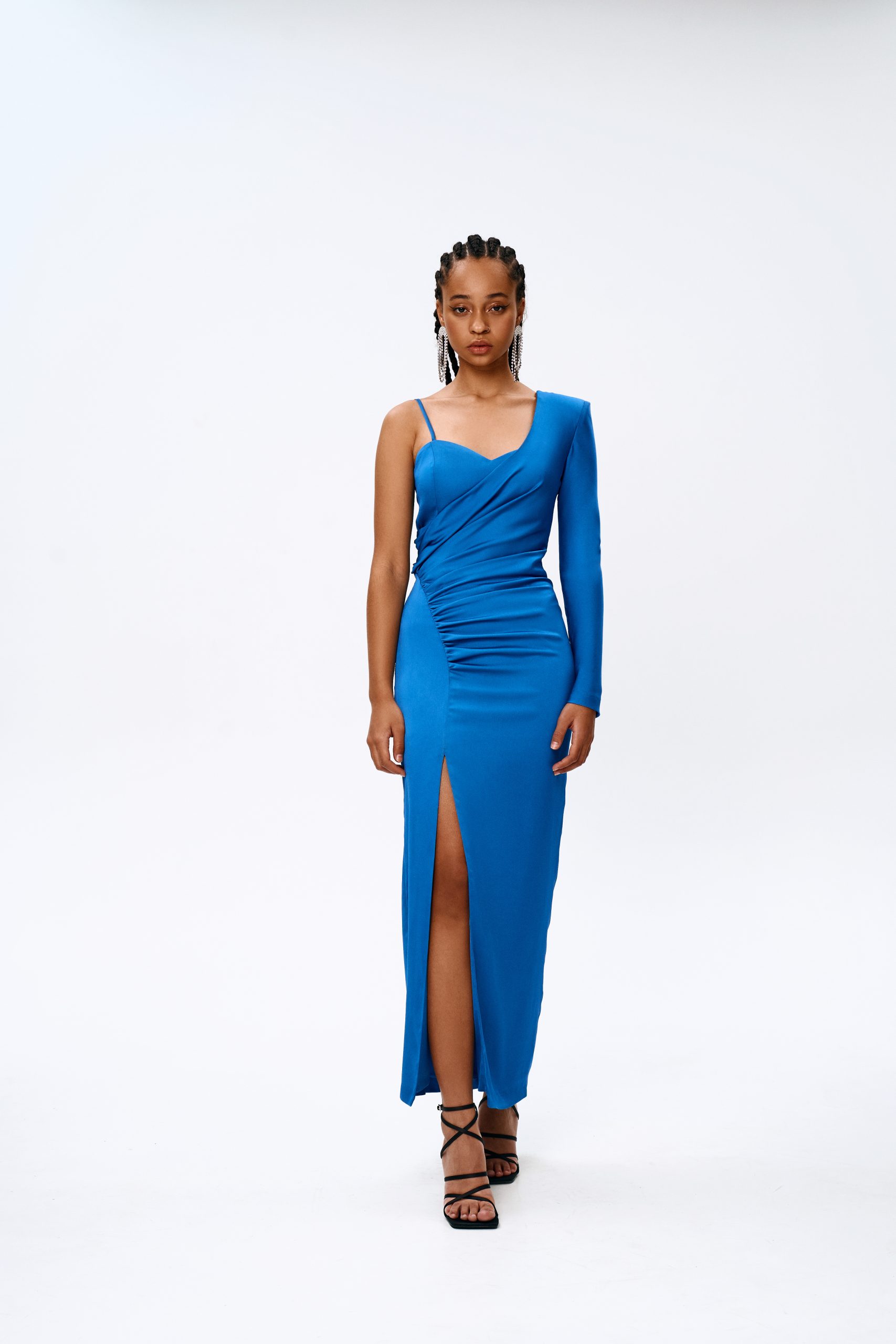 Woman wearing the Colette Dress sewing pattern from Vikisews on The Fold Line. A dress pattern made in natural silk, artificial silk, satin, dress-weight viscose or stretch crepe fabrics, featuring a close-fit, asymmetrical one-shoulder design, one long s