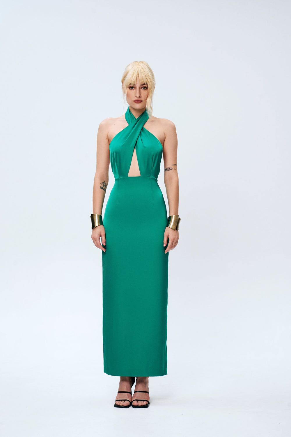 Woman wearing the Crystal Dress sewing pattern from Vikisews on The Fold Line. A dress pattern made in dress-weight viscose, silk, viscose or artificial silk fabrics, featuring a close-fit, accentuated waist, front bodice shaped with deep pleats that cris