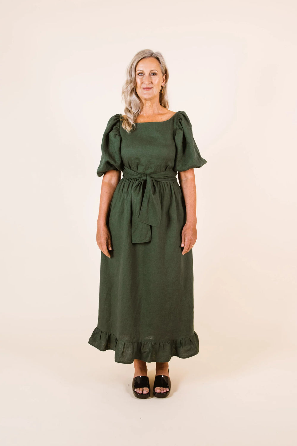 Women wearing the Estella Dress sewing pattern from Papercut Patterns on The Fold Line. A dress pattern made in cotton, linen, silk or rayon fabrics, featuring elbow length puff sleeves, relaxed fit, frilled hem, ankle length, elasticated waist, pockets,
