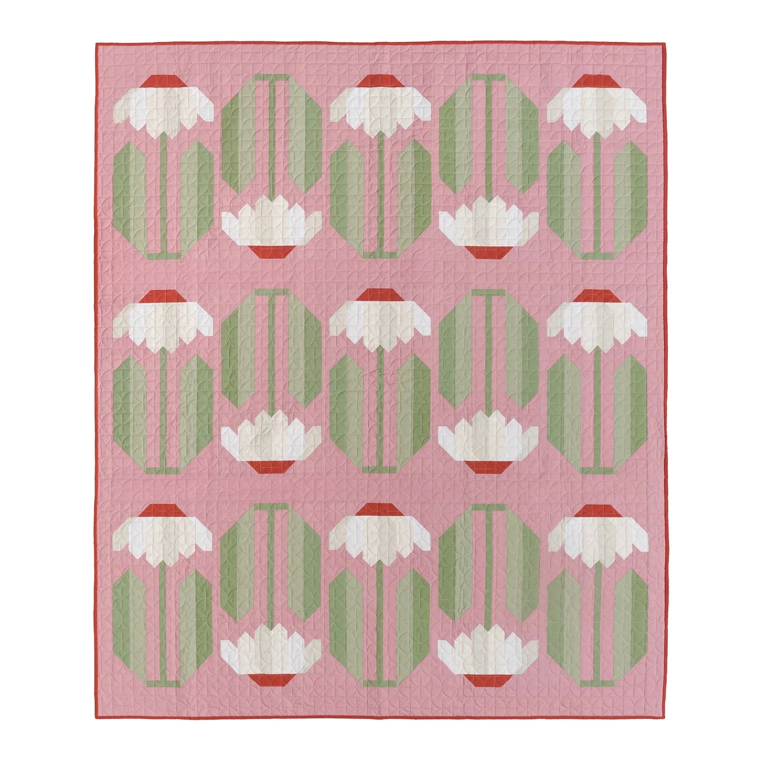 Photo showing the Everbloom Quilt sewing pattern from Pen and Paper Patterns on The Fold Line. A quilt pattern made in quilting cotton fabrics, featuring alternating upright and upside down red flowers with white petals and green leaves on a pink backgrou