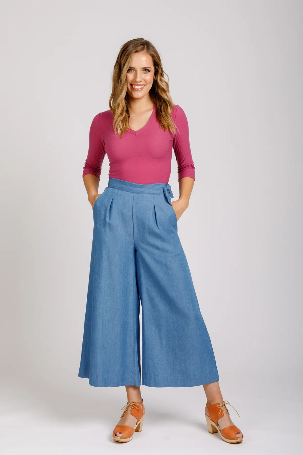 Woman wearing the Flint Pants and Shorts sewing pattern from Megan Nielsen on The Fold Line. A trouser pattern made in denim, twill, poplin, broadcloth, linens, suiting, gabardine, pique, wool blends, cottons, rayon, tencels, or silk fabrics, featuring a
