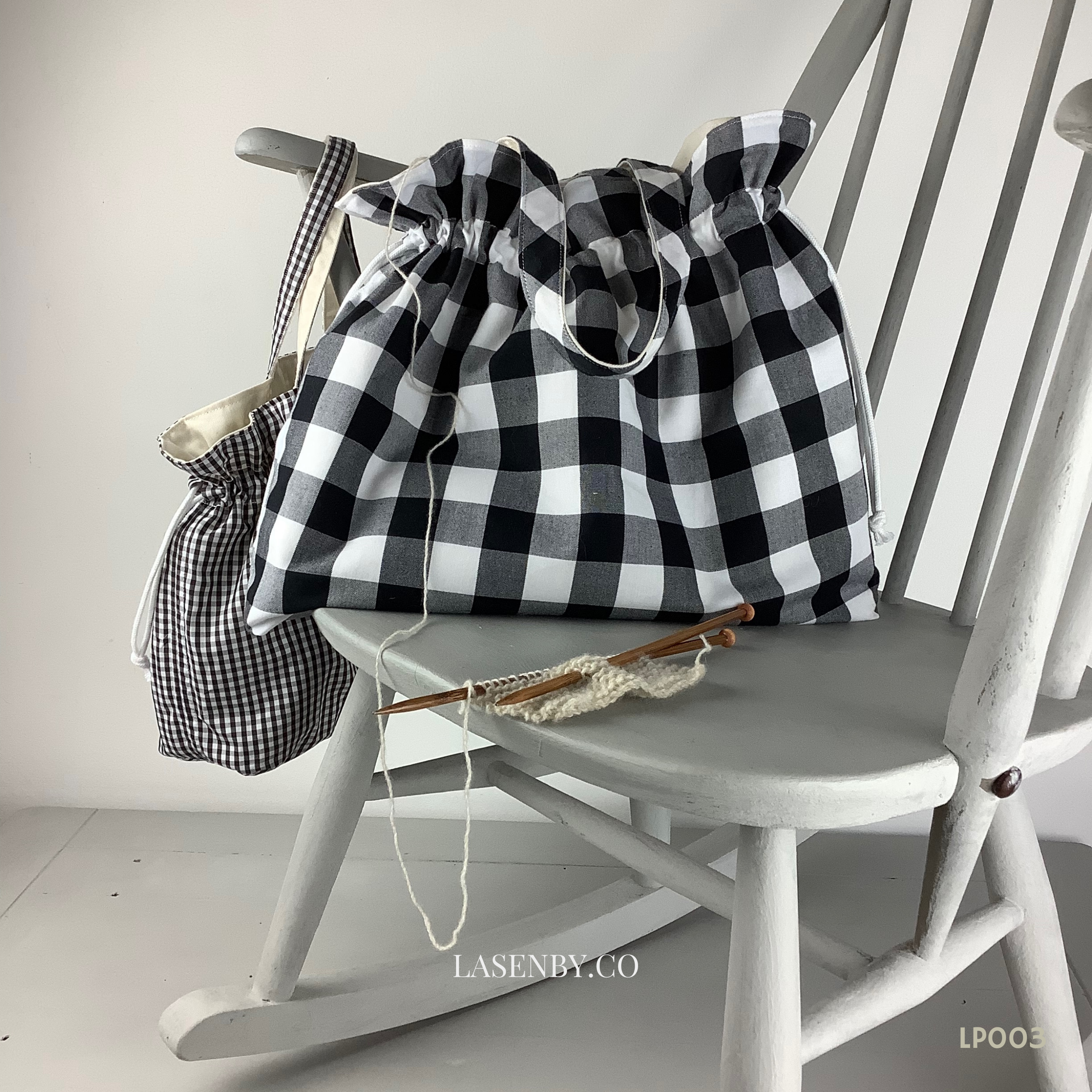 Photo showing the Hebe Project Bag sewing pattern from Lasenby on The Fold Line. A tote bag pattern made in canvas, linen, quilting cotton, twill, duck, denim, upholstery and thinner tweed fabrics, featuring two size options, two handle lengths, multiple