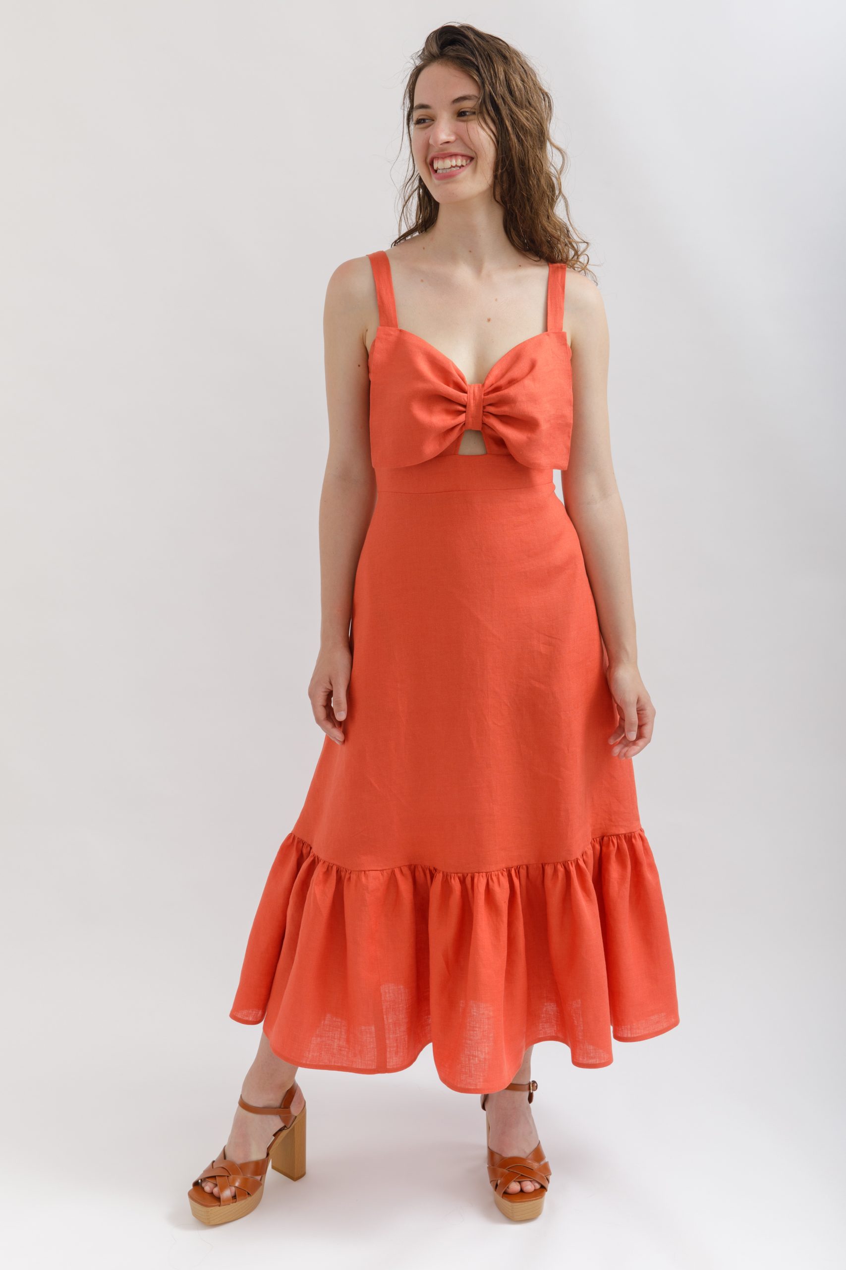 Women wearing the Joelle Dress sewing pattern from Sew Love Patterns on The Fold Line. A dress pattern made in cotton, linen, viscose, tencel, chambray, lighter weight denim, crepe or rayon fabrics, featuring a frilled hem, maxi length, narrow shoulder st