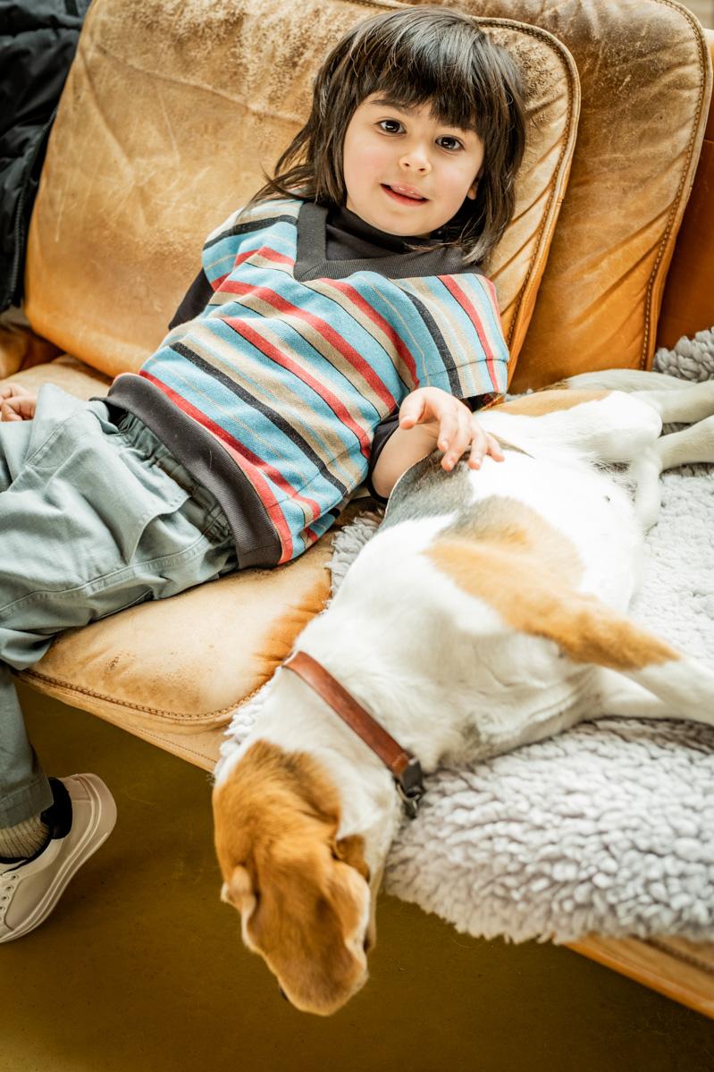 Child wearing the Jules Jumper sewing pattern from Fibre Mood on The Fold Line. A sleeveless jumper pattern made in chunky knit, French terry, sweatshirt, ribbed knit or knit jacquard fabrics, featuring a deep V-neck, relaxed fit, short grown on sleeves,