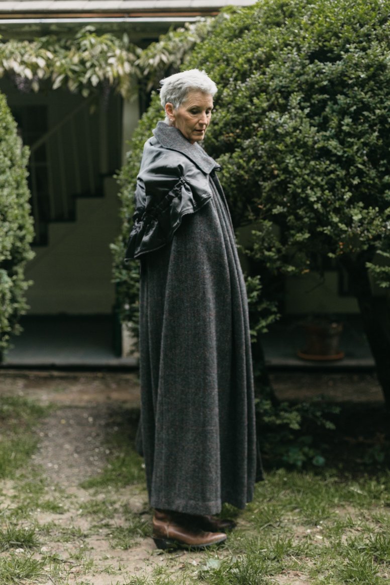 Women wearing the 207 Unisex Kinsale Cloak sewing pattern from Folkwear on The Fold Line. A voluminous cloak pattern made in wool, velvet, corduroy, poplin, denim or chintz fabrics, featuring a detachable hood, wide collar, large hook and eye fasteners, f