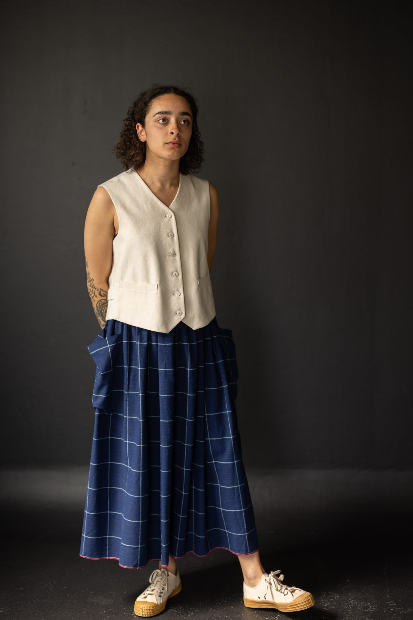 Woman wearing the Mathilde Skirt sewing pattern from Merchant & Mills on The Fold Line. A skirt pattern made in linen, brushed cotton, cotton lawn, cotton poplin, tencel, Indian handlooms, lightweight baby cord or cotton double gauze fabrics, featuring a