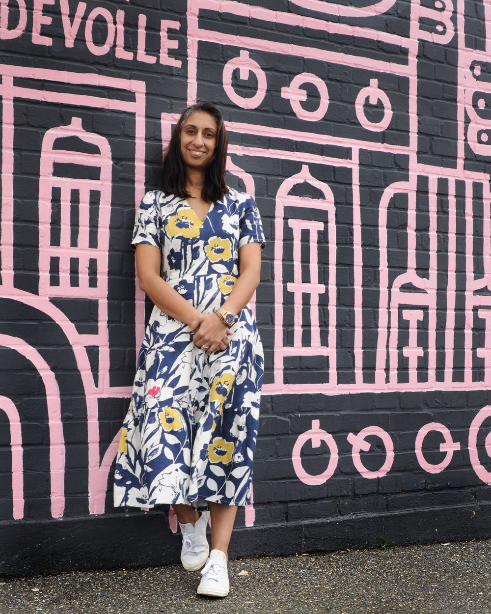 Woman wearing the Mia Dress sewing pattern by Make with Mandi. A dress pattern made in light-to-medium weight woven fabrics such as cottons, linens or viscose fabrics, featuring a fitted bodice, three skirt tiers with gathers, a v-neck at the front and an