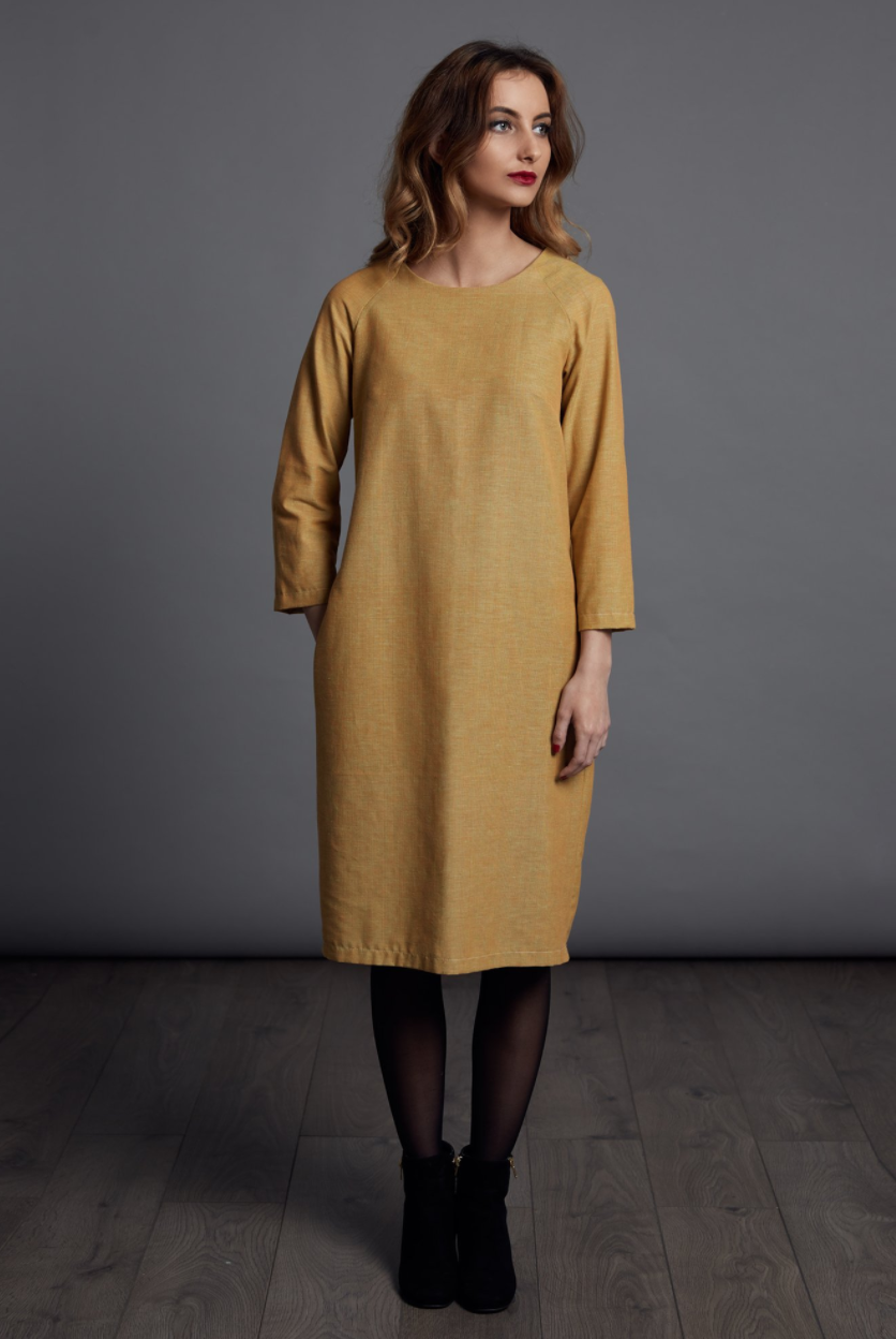 Woman wearing The Gathered Dress sewing pattern from The Avid Seamstress on The Fold Line. A dress pattern made in denim, chambray, crepe, silk, viscose or cotton fabrics, featuring raglan sleeves, in-seam pockets, round neck, back invisible zip closure,
