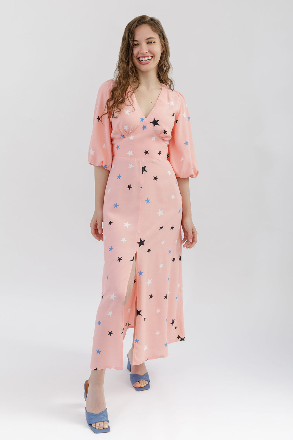 Women wearing the Springe Dress sewing pattern from Sew Love Patterns on The Fold Line. A dress pattern made in cotton, linen, viscose, cupro, crepe or rayon fabrics, featuring a V-neck, under bust gathering, curved waistband, fitted bodice, elbow length