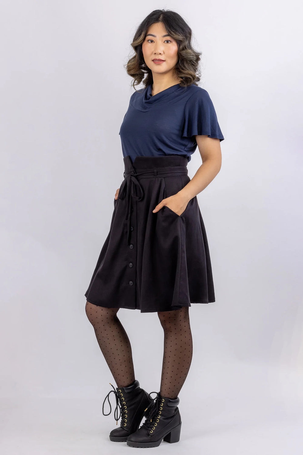 Woman wearing the Sylvie Top sewing pattern from Forget-me-not Patterns on The Fold Line. A knit top pattern made in cotton jersey, viscose/rayon jersey, merino jersey or silk jersey fabrics, featuring a cowl neck, flutter sleeves, front and back yokes.