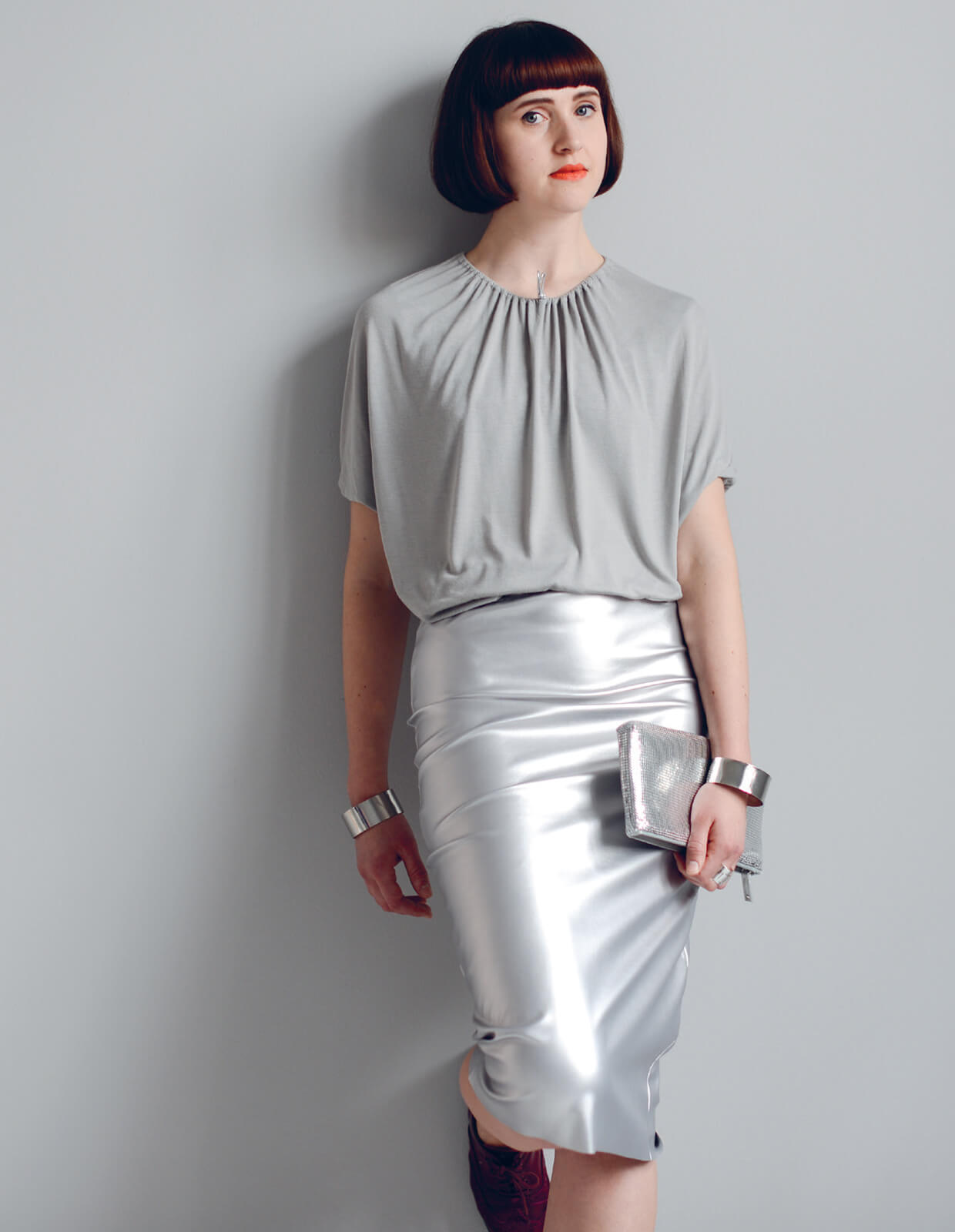 Woman wearing the Ultimate Pencil Skirt sewing pattern from The Maker's Atelier on The Fold Line. A pencil skirt pattern made in medium weight cottons, denim, linen, some woollens, woven or jersey fabrics with lycra or elastane, featuring an elasticated w
