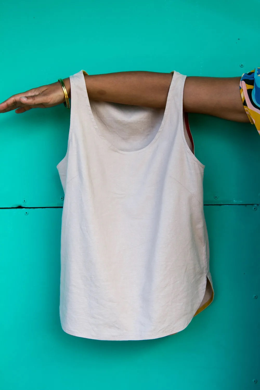 Image showing the Tara Tank sewing pattern from Make With Mandi on The Fold Line. A tank pattern made in linen, silk, viscose, cotton lawn, double gauze, chambray, seersucker or crepe fabrics, featuring a scoop neckline, sleeveless, no fastenings and rela