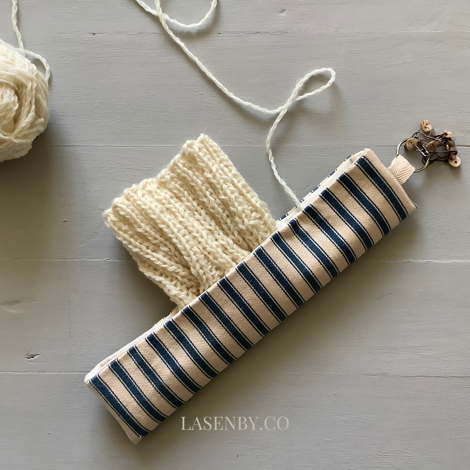 Photo showing the Free Teasel Knitting Pouch sewing pattern from Lasenby on The Fold Line. A knitting pouch pattern made in Tana lawn, cotton, linen, bamboo, quilting cotton, twill, canvas, and drill fabrics, featuring a pouch for double-pointed needles,