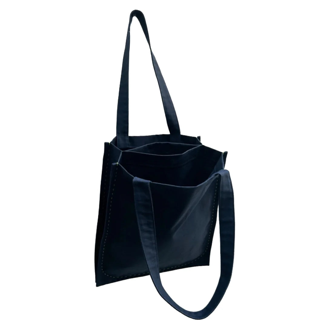 Image showing the Twin Tote sewing pattern from Dhurata Davies Patterns on The Fold Line. A tote bag pattern made in cotton canvas, twill, Panama, half Panama, oilskin, some cotton and linen mixes, and some quilted fabrics, featuring a rectangular silhoue
