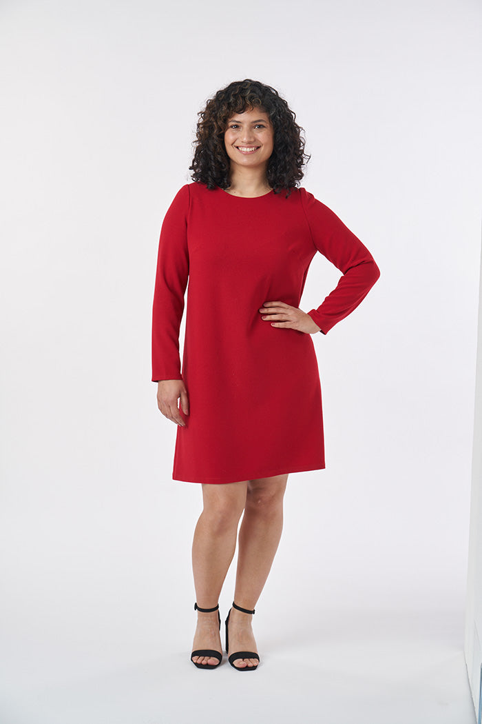 Woman wearing the Ultimate Shift Dress sewing pattern from Sew over It on The Fold Line. A dress pattern made in cotton, cotton lawn, rayon or crepe fabrics, featuring bust darts, full length sleeves, knee length finish, round neckline, hook and eye back