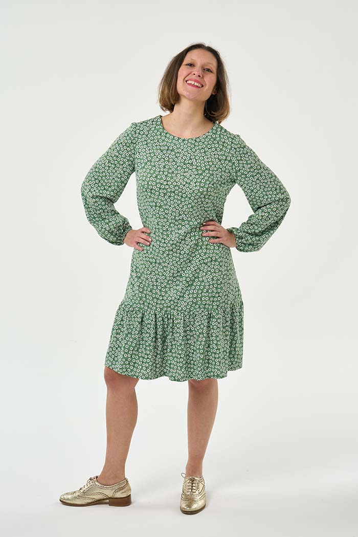 Woman wearing the Ultimate Shift Dress sewing pattern from Sew Over It on The Fold Line. A shift dress pattern made in cotton, cotton lawn, rayon or crepe fabrics, featuring add-ons of a more voluminous elasticated sleeve, tie cuff detail to the original
