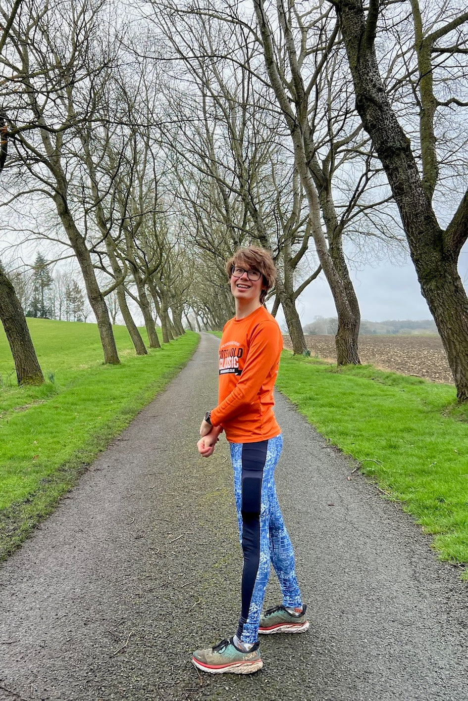Teen wearing the Teen Boys’ Callisto Leggings sewing pattern from Waves & Wild on The Fold Line. A leggings pattern made in 4-way stretch knit fabric, featuring a colour-blocked stripe and phone pocket.
