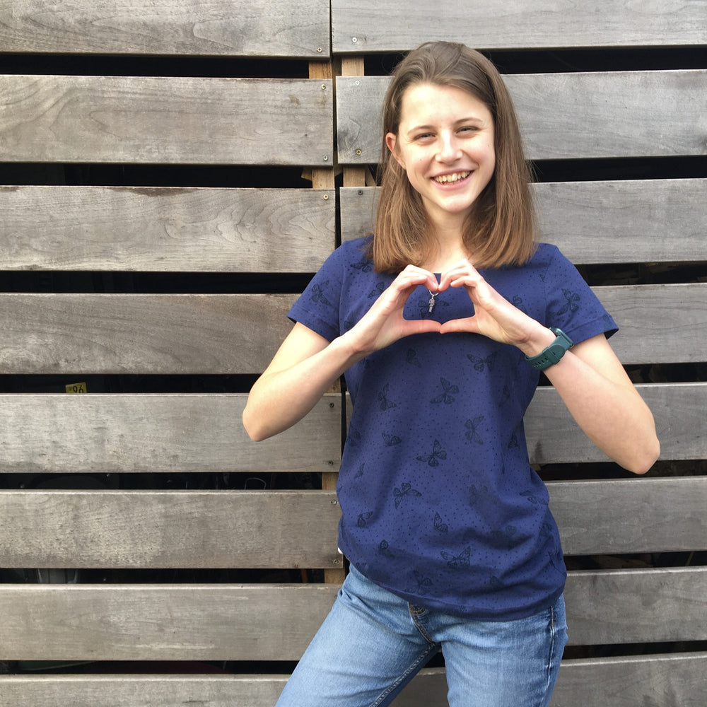 Child wearing the Tween/Teen Girls' Triple T T-shirt sewing pattern from Waves & Wild on The Fold Line. A T-shirt pattern made in cotton/Lycra jersey, rayon/Lycra jersey, or bamboo/Lycra jersey fabrics, featuring short sleeves, relaxed fit, crew neck and