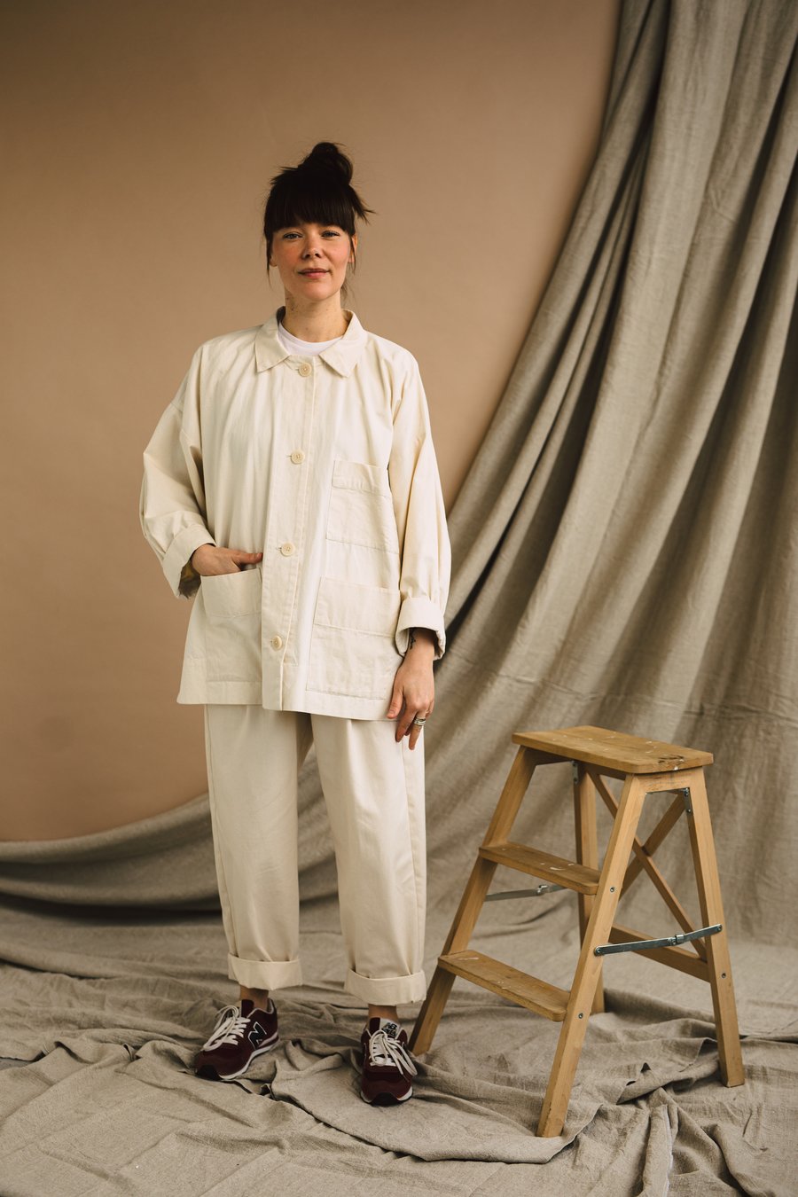 Woman wearing the Unisex ZW Workwear Jacket sewing pattern from Birgitta Helmersson on The Fold Line. A jacket pattern made in mid-heavy weight linen or cotton, light to mid weight wool coating or cotton corduroy fabric, featuring an oversize silhouette,