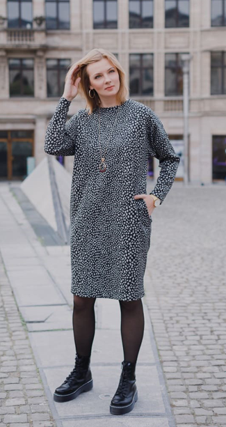 Woman wearing the Alex Dress sewing pattern from Lenaline Patterns on The Fold Line. A dress pattern made in stretch fabrics such as mesh, sweat, fleece sweat, fleece jersey or neoprene fabrics, featuring dropped shoulders with full length sleeves, round