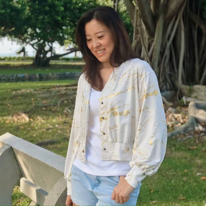 Woman wearing Balloon Cardigan sewing pattern from Wardrobe by Me on The Fold Line. A cardigan pattern made in light to medium weight jersey fabrics, featuring a relaxed fit, dropped shoulders, banded edges, sleeves and body are gathered to the cuffs and