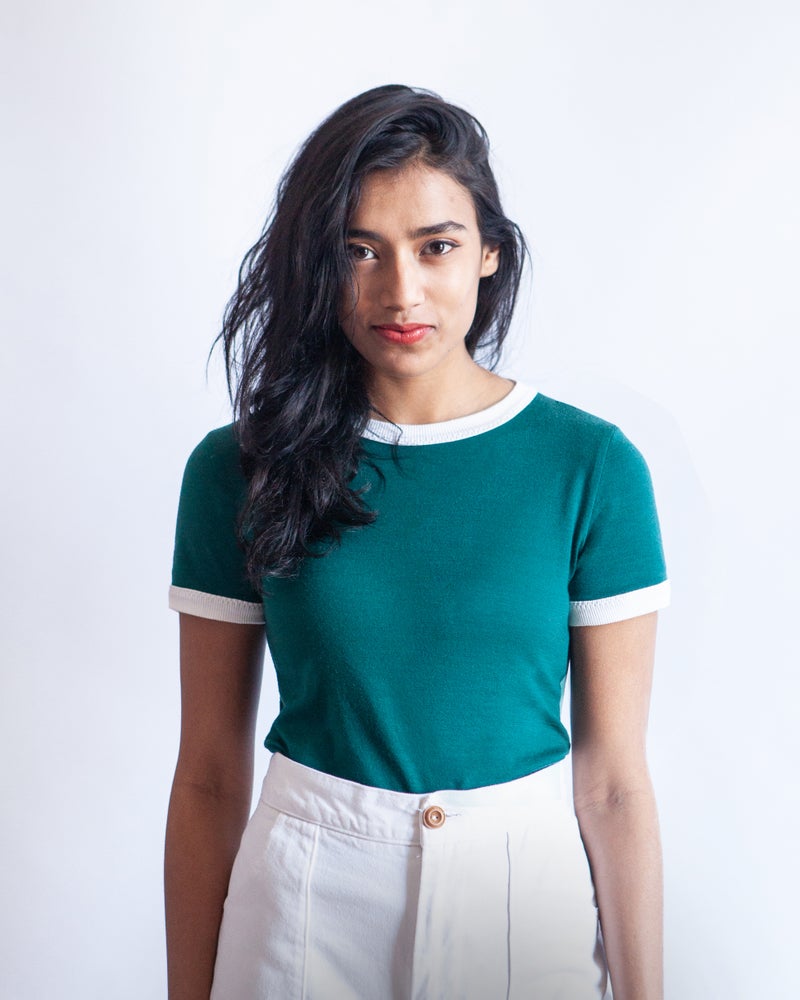 Woman wearing the Rio Ringer T-shirt sewing pattern by True Bias. A T-shirt pattern made in cotton interlock or T-shirt jersey fabric, featuring contrasting ribbing around the crew neckline and short sleeves.