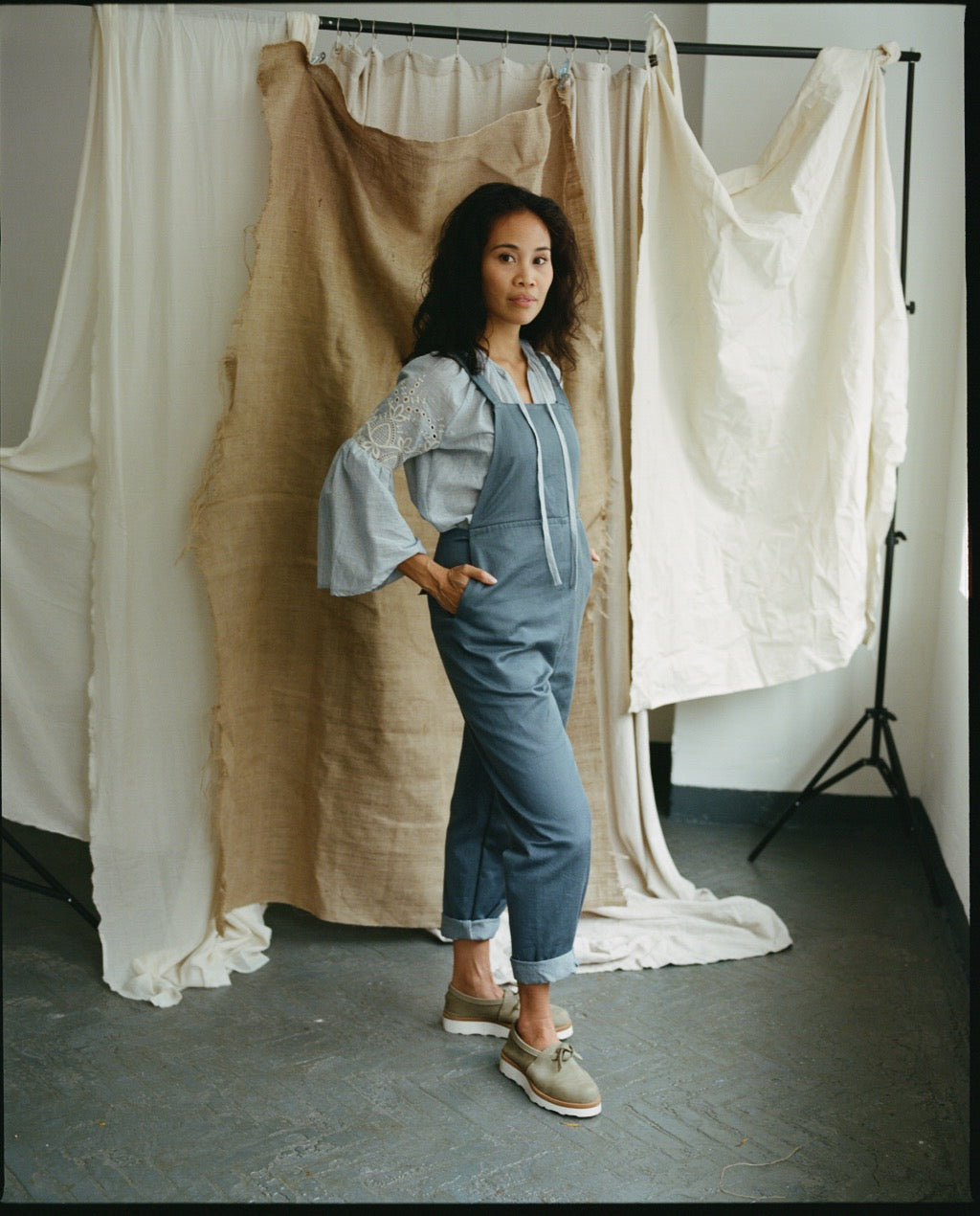 Women wearing the Greta Dungarees sewing pattern from Made My Wardrobe on The Fold Line. A dungaree pattern made in denim, corduroy, chambray, heavy linen or cotton twill fabrics, featuring deep pockets, adjustable waist tie and non-adjustable shoulder st