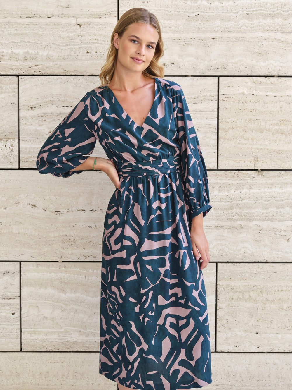 Women wearing the Alana Dress sewing pattern from Atelier Jupe on The Fold Line. A dress pattern made in viscose, cotton, tencel, linen, double gauze or non-static polyester fabrics, featuring a low V-neck, wide 7/8th sleeves, gathered skirt, small pleats