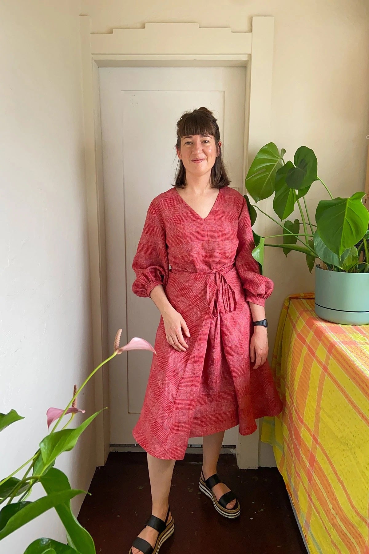 Woman wearing the Acton Dress sewing pattern from In the Folds on The Fold Line. A dress pattern made in linen, cotton, gauze, chambray, sateen, silk, viscose or rayon fabrics, featuring extra add-ons such as new two sleeve options and new bodice.