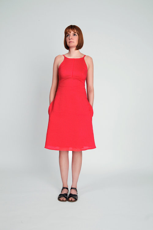 Woman wearing the Acton Dress pattern from In the Folds on The Fold Line. A dress pattern made in linen, cotton, chambray, sateen, silk crepe de chine or viscose rayon fabrics, featuring a fitted bodice, low back, thin shoulder straps, A-line skirt, in-se