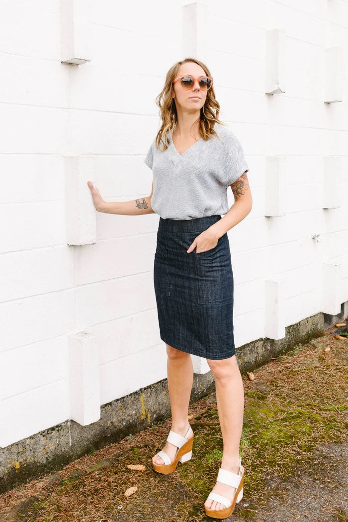 Woman wearing the Alberta Street Pencil Skirt sewing pattern from Sew House Seven on The Fold Line. A pencil skirt pattern made in denim, canvas, corduroy, twill, gabardine, poplin, sateen or stretch woven fabrics, featuring a slim fit, no ease at the hip