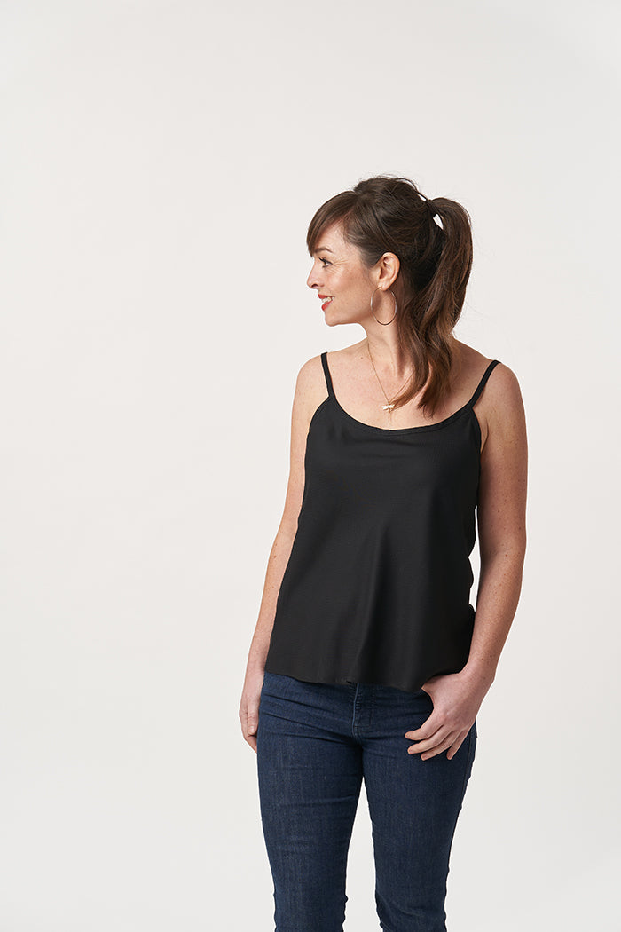 Woman wearing the Alderley Top sewing pattern from Sew Over It on The Fold Line. A cami top pattern made in cotton lawn, viscose, crepe, georgette or silk fabrics, featuring bust darts, french seams, and bias binding straps.
