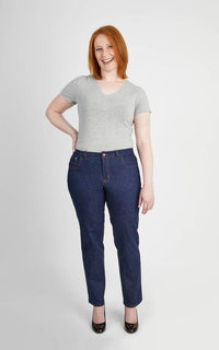 Woman wearing the Ames Jeans sewing pattern by Cashmerette. A jeans pattern made in stretch denim fabric featuring straight leg, 5 pockets, fly front and topstitching.